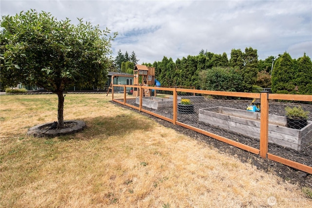 1729 154th St S, Spanaway, WA 98387 - view of yard with a playground and a vegetable garden