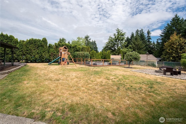 1729 154th St S, Spanaway, WA 98387 - view of yard with a playground, a garden, and view of wooded area