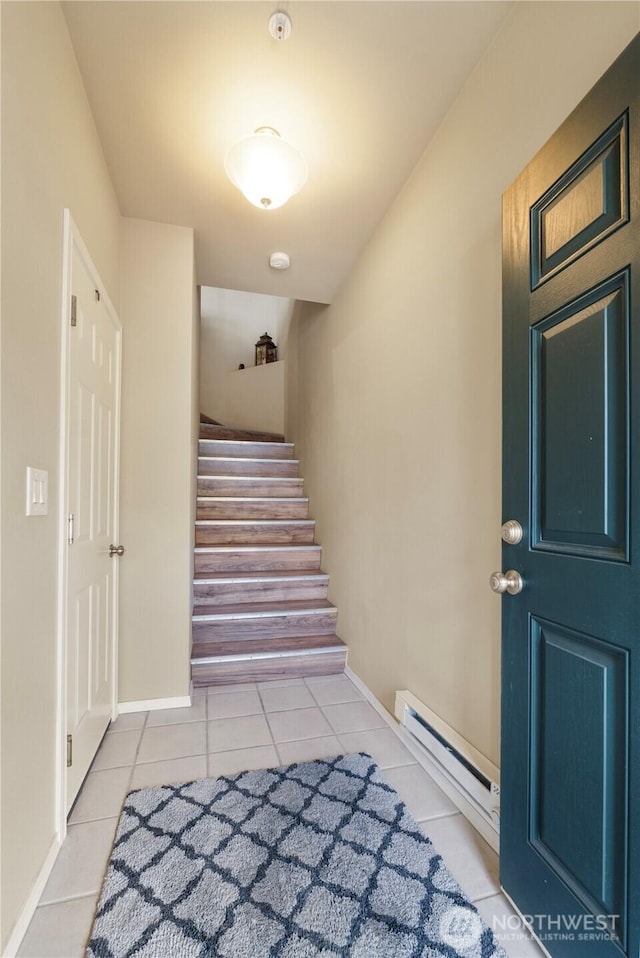 6137 Hazel Loop SE Unit D, Auburn, WA 98092 - stairway featuring a baseboard heating unit and tile patterned floors