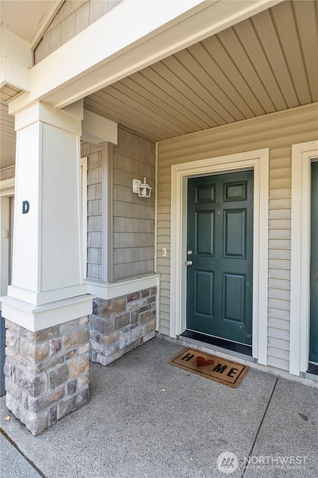 6137 Hazel Loop SE Unit D, Auburn, WA 98092 - entrance to property with covered porch and stone siding