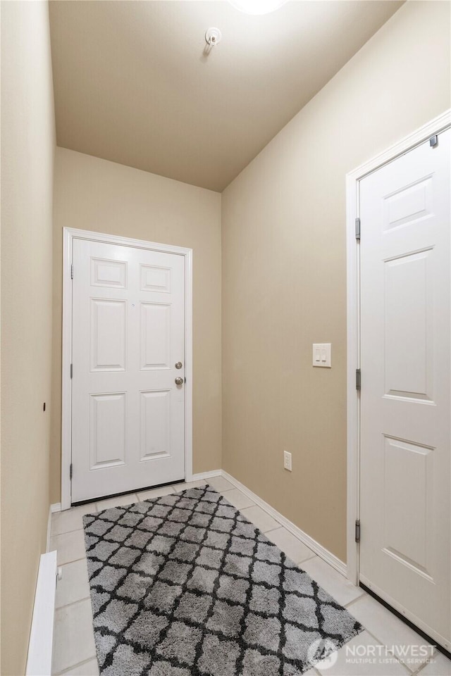 6137 Hazel Loop SE Unit D, Auburn, WA 98092 - foyer entrance featuring light tile patterned flooring and baseboards