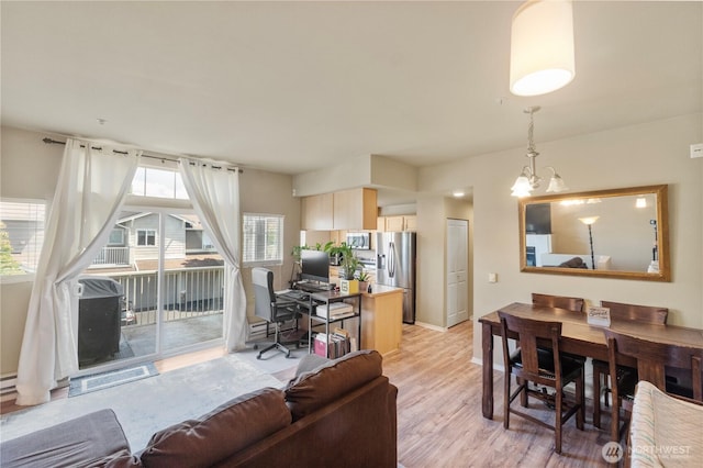 6137 Hazel Loop SE Unit D, Auburn, WA 98092 - living room featuring an office area, light wood-style flooring, and a chandelier