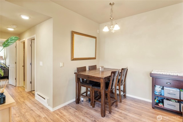 6137 Hazel Loop SE Unit D, Auburn, WA 98092 - dining area with a chandelier and wood finished floors