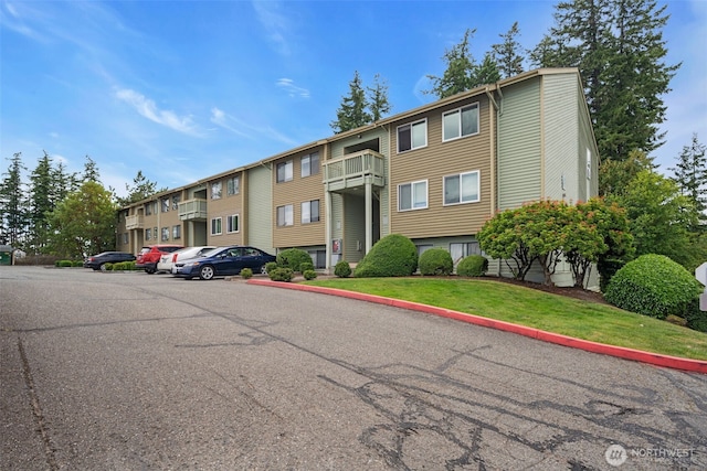 1780 W Sunn Fjord Ln Unit E306, Bremerton, WA 98312 - view of building exterior featuring uncovered parking