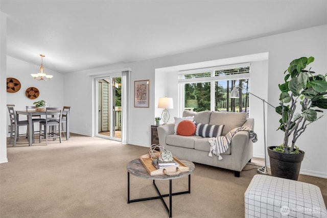 1780 W Sunn Fjord Ln Unit E306, Bremerton, WA 98312 - living area with plenty of natural light, a chandelier, carpet flooring, and lofted ceiling