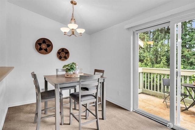 1780 W Sunn Fjord Ln Unit E306, Bremerton, WA 98312 - dining room featuring a chandelier and light colored carpet