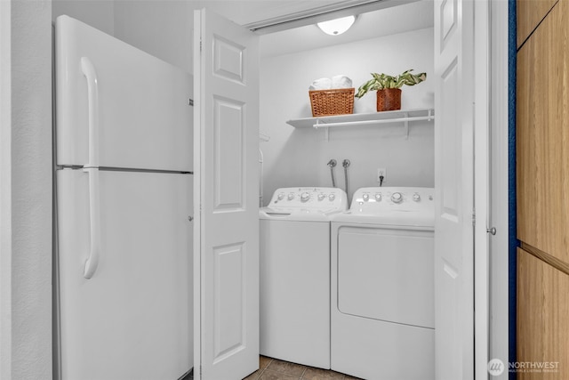 1780 W Sunn Fjord Ln Unit E306, Bremerton, WA 98312 - laundry area featuring washer and dryer and tile patterned floors