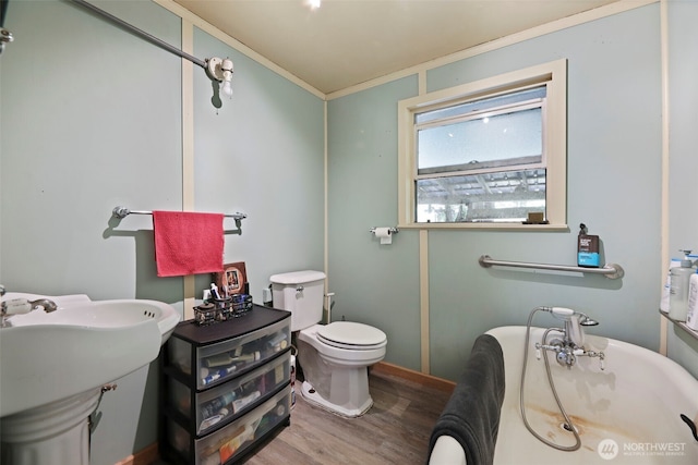 30124 Ramstad Rd, Arlington, WA 98223 - full bath featuring a soaking tub, wood finished floors, and crown molding