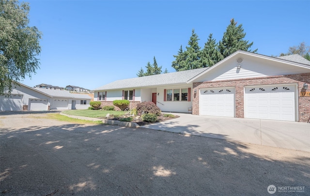 3716 Knowles Rd, Wenatchee, WA 98801 - single story home with brick siding, an attached garage, and driveway