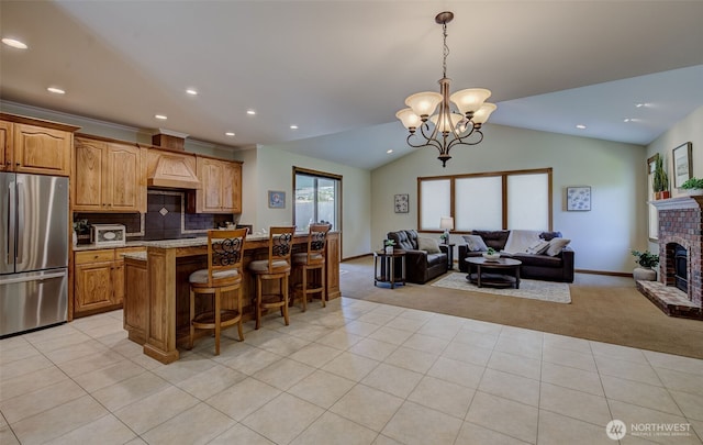 3716 Knowles Rd, Wenatchee, WA 98801 - kitchen with stainless steel fridge, light carpet, open floor plan, a breakfast bar, and recessed lighting