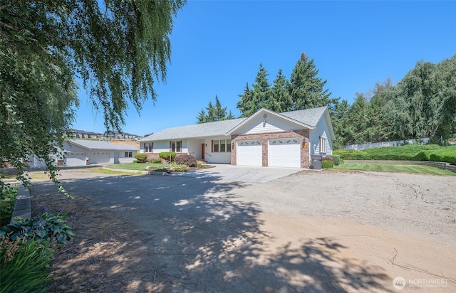 3716 Knowles Rd, Wenatchee, WA 98801 - ranch-style house featuring an attached garage, driveway, and brick siding