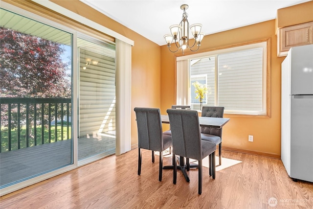 639 W Horton Way Unit 228, Bellingham, WA 98226 - dining space with a chandelier and wood finished floors