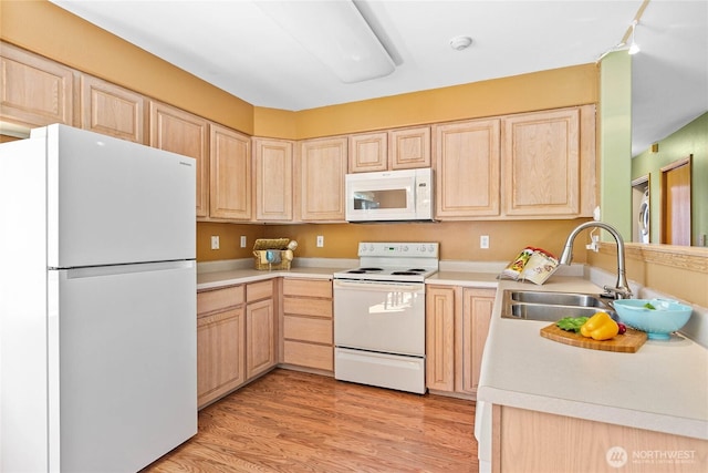 639 W Horton Way Unit 228, Bellingham, WA 98226 - kitchen featuring white appliances, light brown cabinets, light countertops, and light wood finished floors