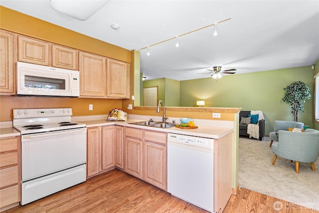 639 W Horton Way Unit 228, Bellingham, WA 98226 - kitchen with white appliances, light brown cabinetry, open floor plan, a peninsula, and track lighting