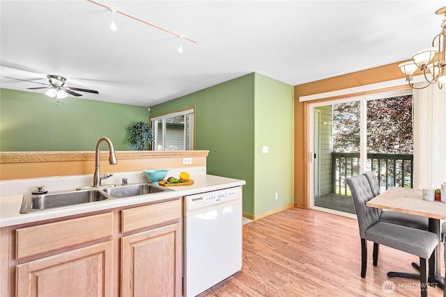 639 W Horton Way Unit 228, Bellingham, WA 98226 - kitchen with dishwasher, light brown cabinetry, light countertops, light wood finished floors, and track lighting