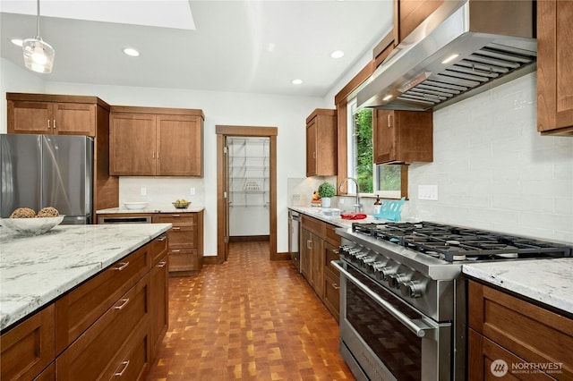 13830 Old Snohomish Monroe Rd, Snohomish, WA 98290 - kitchen featuring appliances with stainless steel finishes, extractor fan, backsplash, light stone countertops, and recessed lighting