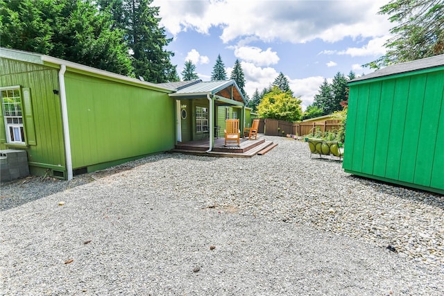 4508 36th Ct SE, Lacey, WA 98503 - view of property exterior featuring a wooden deck and a metal roof