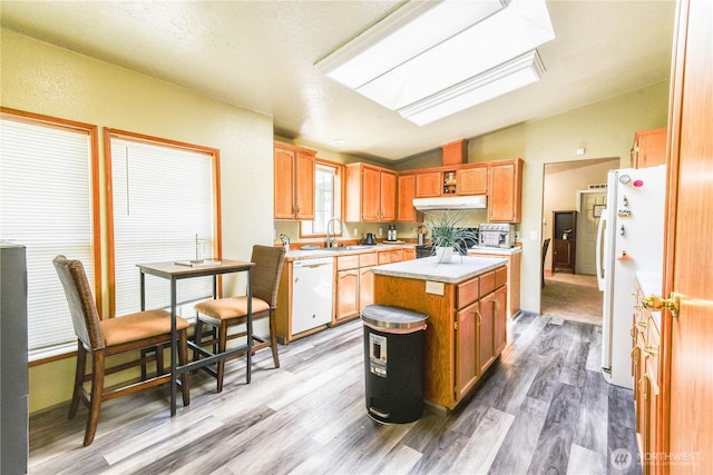 4508 36th Ct SE, Lacey, WA 98503 - kitchen featuring white appliances, lofted ceiling, light wood-type flooring, light countertops, and a center island