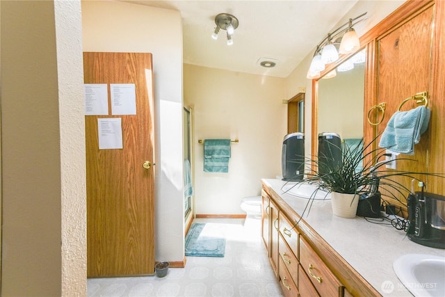4508 36th Ct SE, Lacey, WA 98503 - bathroom featuring a shower stall, double vanity, and tile patterned floors
