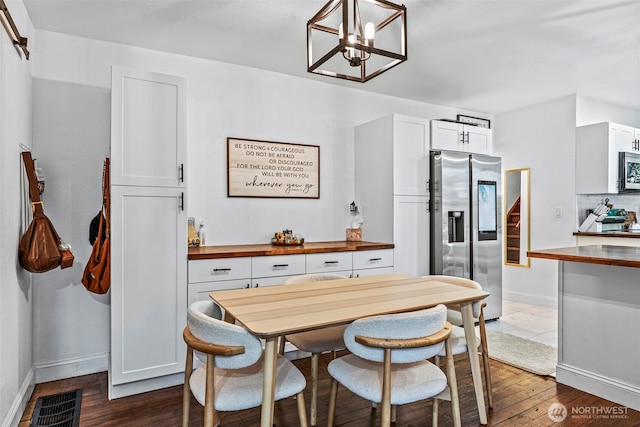 505 NE Jefferson, Chehalis, WA 98532 - dining room with dark wood finished floors, stairs, and a chandelier