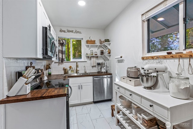 505 NE Jefferson, Chehalis, WA 98532 - kitchen with wood counters, appliances with stainless steel finishes, light marble finish floors, tasteful backsplash, and open shelves