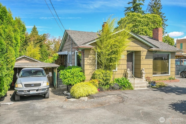 9713 4th Ave W, Everett, WA 98204 - view of front facade with a chimney and a shingled roof
