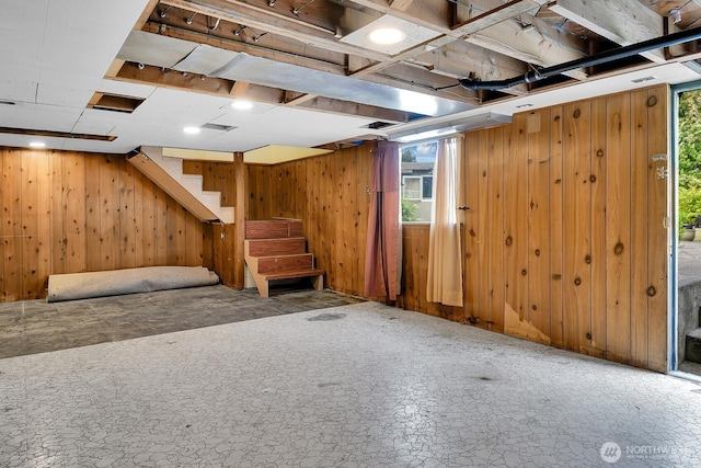 9713 4th Ave W, Everett, WA 98204 - below grade area with wood walls, plenty of natural light, and stairway