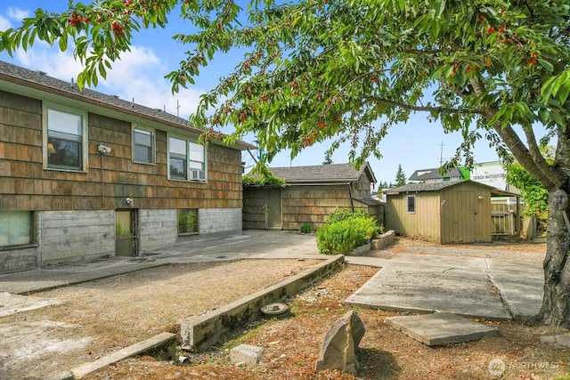 9713 4th Ave W, Everett, WA 98204 - view of yard featuring a patio and a storage unit