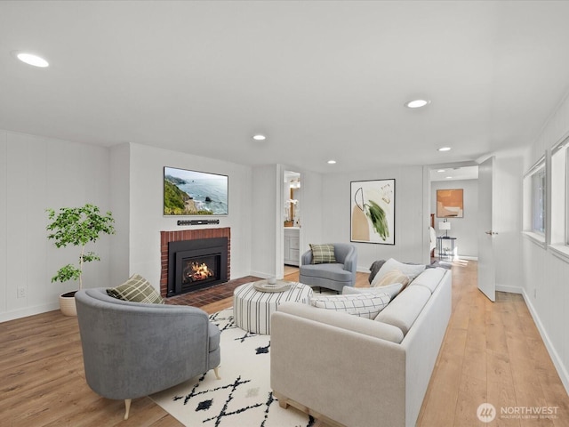 13514 3rd Ave NE, Seattle, WA 98125 - living room featuring light wood finished floors, a brick fireplace, and recessed lighting