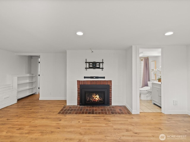 13514 3rd Ave NE, Seattle, WA 98125 - unfurnished living room featuring light wood-type flooring, a brick fireplace, and recessed lighting