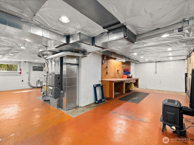 13514 3rd Ave NE, Seattle, WA 98125 - basement with a workshop area and heating unit