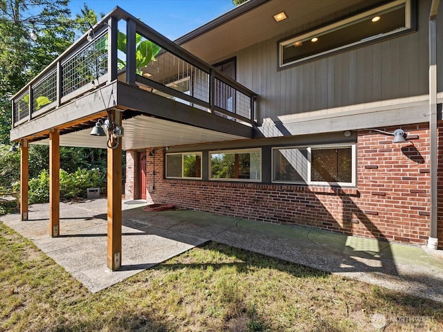 13514 3rd Ave NE, Seattle, WA 98125 - view of home's exterior featuring brick siding and a patio area