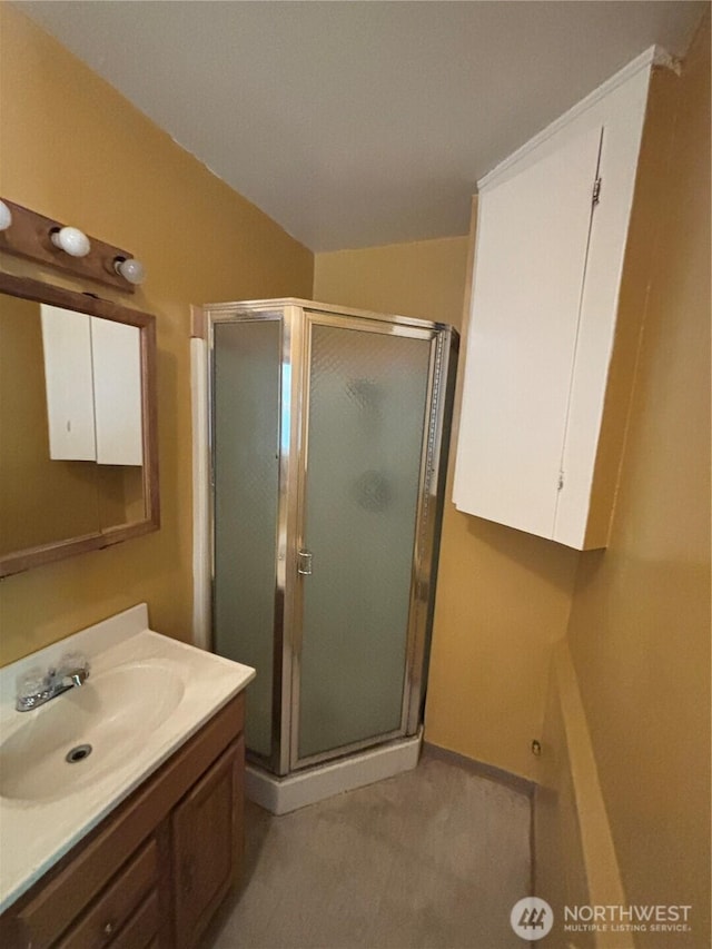 214 N 2nd St, Dayton, WA 99328 - bathroom with vanity, a shower stall, and vaulted ceiling