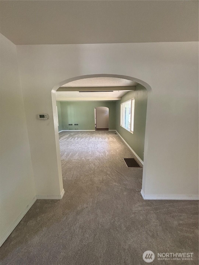 214 N 2nd St, Dayton, WA 99328 - empty room featuring arched walkways and carpet flooring