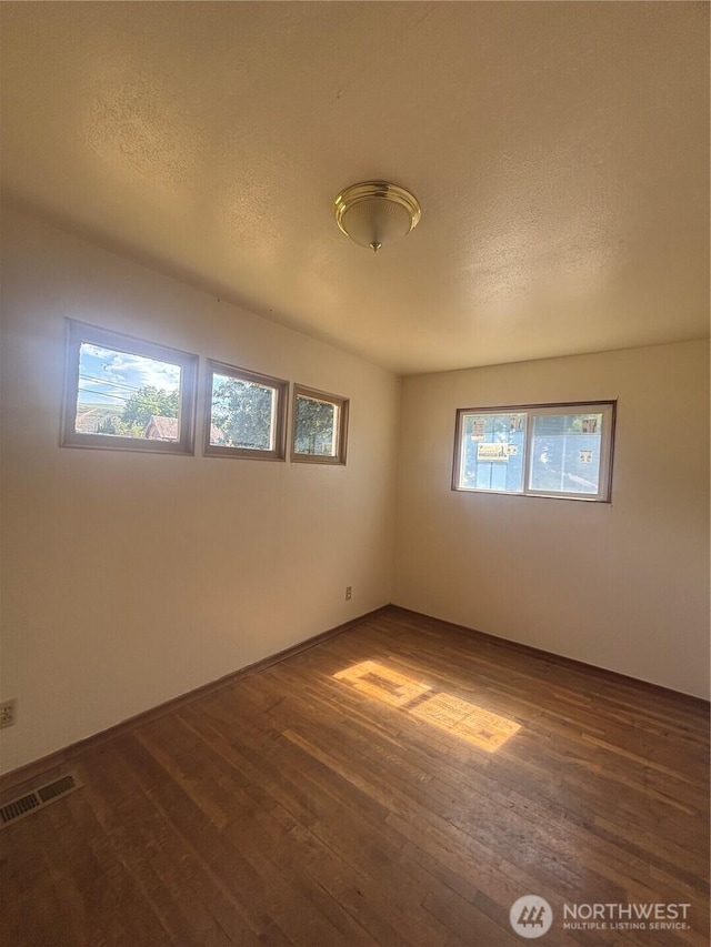 214 N 2nd St, Dayton, WA 99328 - spare room with dark wood-style floors and a textured ceiling