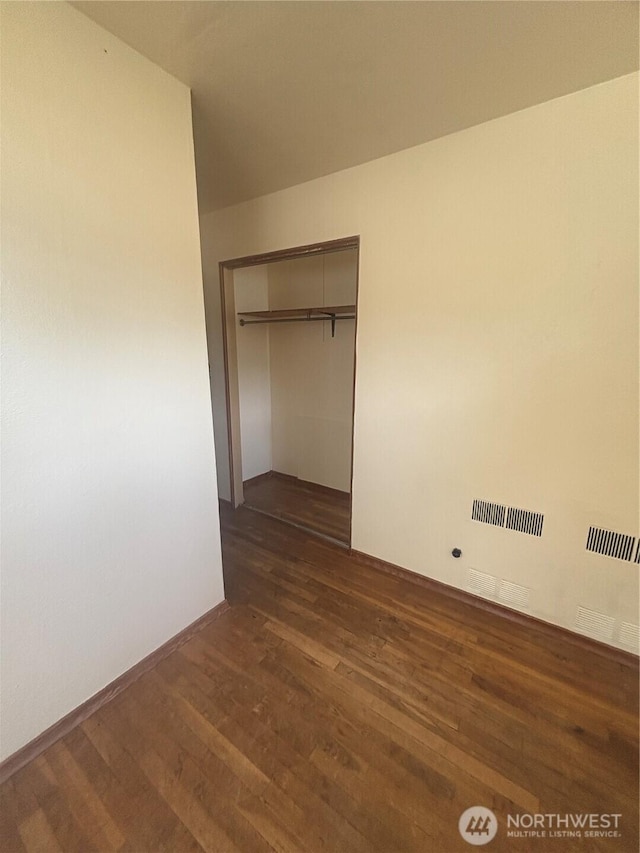 214 N 2nd St, Dayton, WA 99328 - unfurnished bedroom with dark wood finished floors and a closet