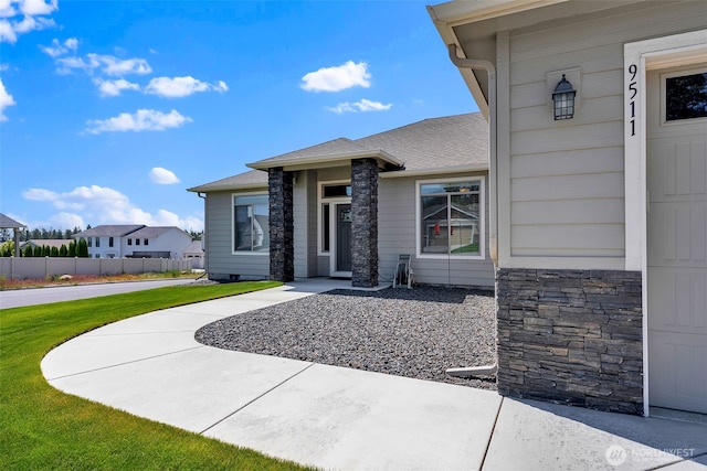 9511 W Floyd Dr, Cheney, WA 99004 - property entrance featuring stone siding and roof with shingles