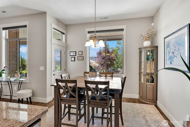 9511 W Floyd Dr, Cheney, WA 99004 - dining space featuring a chandelier and wood finished floors