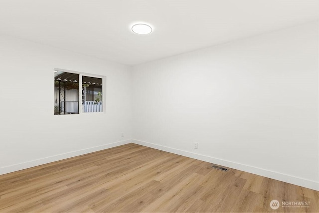 2500 S 370th Unit 227, Federal Way, WA 98003 - unfurnished room with baseboards and light wood finished floors