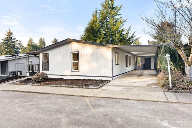 2500 S 370th Unit 227, Federal Way, WA 98003 - manufactured / mobile home with driveway and an attached carport