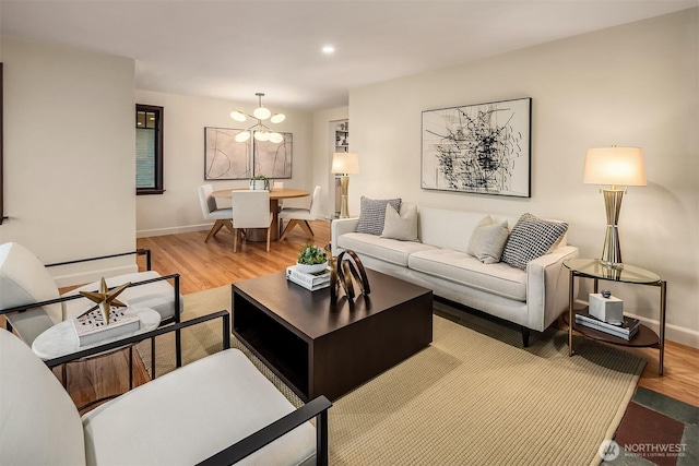 5244 Pullman Ave NE, Seattle, WA 98105 - living area featuring wood finished floors, a chandelier, and recessed lighting