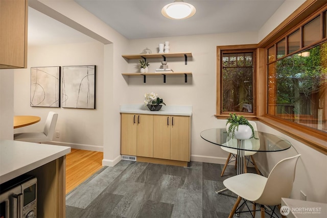 5244 Pullman Ave NE, Seattle, WA 98105 - dining room featuring dark wood-type flooring and baseboards