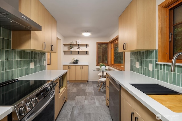 5244 Pullman Ave NE, Seattle, WA 98105 - kitchen featuring extractor fan, stainless steel appliances, light countertops, and decorative backsplash