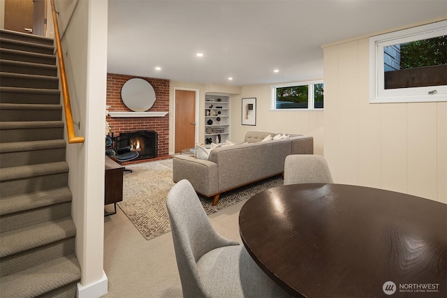 5244 Pullman Ave NE, Seattle, WA 98105 - living room with stairs, built in features, a fireplace, recessed lighting, and carpet floors