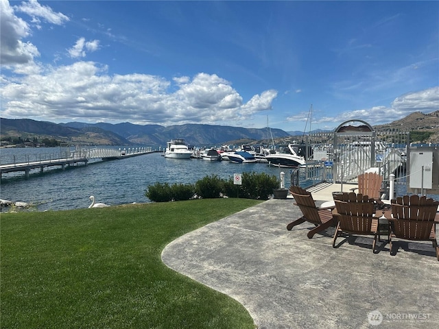 1350 W Woodin Ave Unit Ede2, Chelan, WA 98816 - water view with a mountainous background and a dock