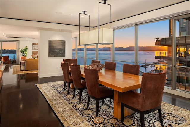 99 Union St Unit 1601, Seattle, WA 98101 - dining area with wood finished floors, healthy amount of natural light, recessed lighting, and a water view