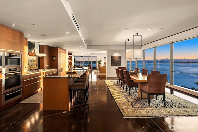 99 Union St Unit 1601, Seattle, WA 98101 - dining room featuring dark wood-type flooring, recessed lighting, and a mountain view