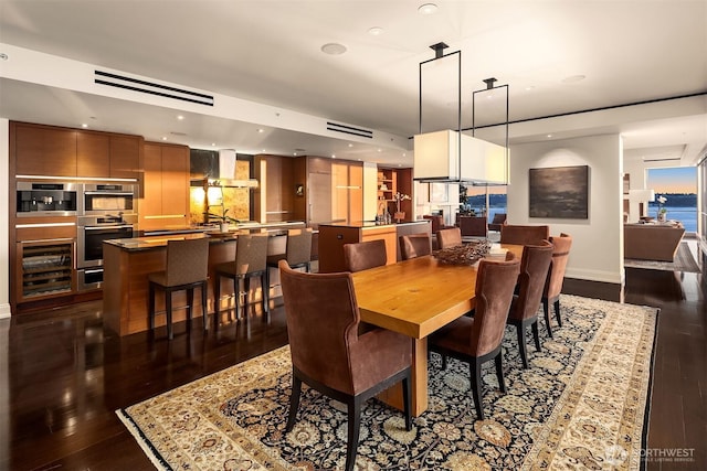 99 Union St Unit 1601, Seattle, WA 98101 - dining space with dark wood-style flooring, recessed lighting, and beverage cooler