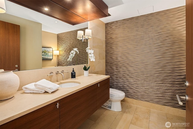 99 Union St Unit 1601, Seattle, WA 98101 - bathroom featuring vanity, tile walls, a shower, and recessed lighting