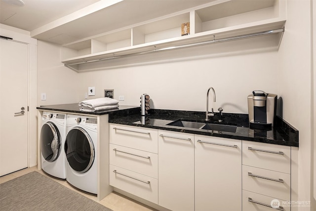 99 Union St Unit 1601, Seattle, WA 98101 - laundry room featuring washing machine and clothes dryer and cabinet space